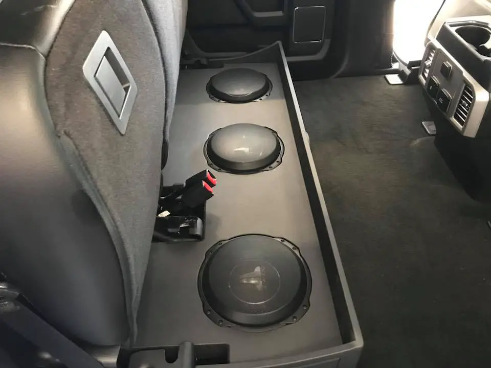 Ford F250 subwoofer box installation under rear seat by Explicit Customs Melbourne FL 11